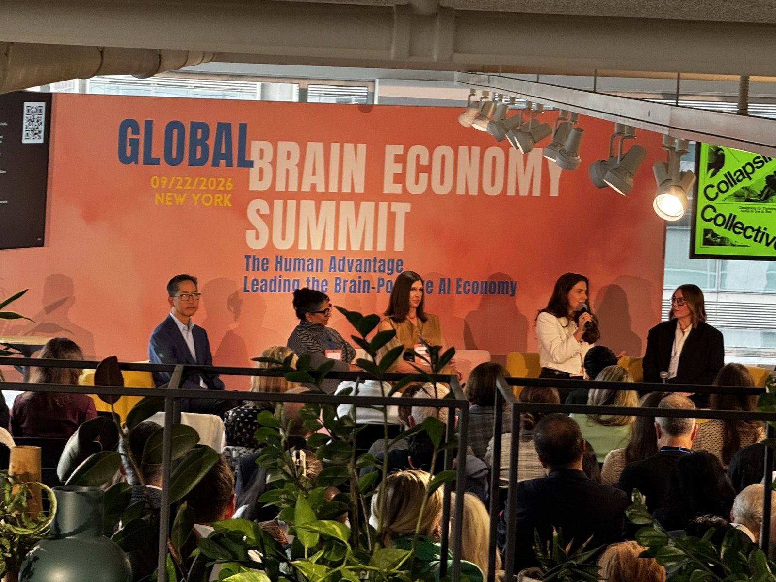 A panel discussion onstage at the Global Brain Economy Summit